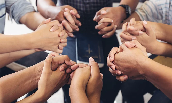 diverse hands holding hold hands circle to pray for God each other support together teamwork
